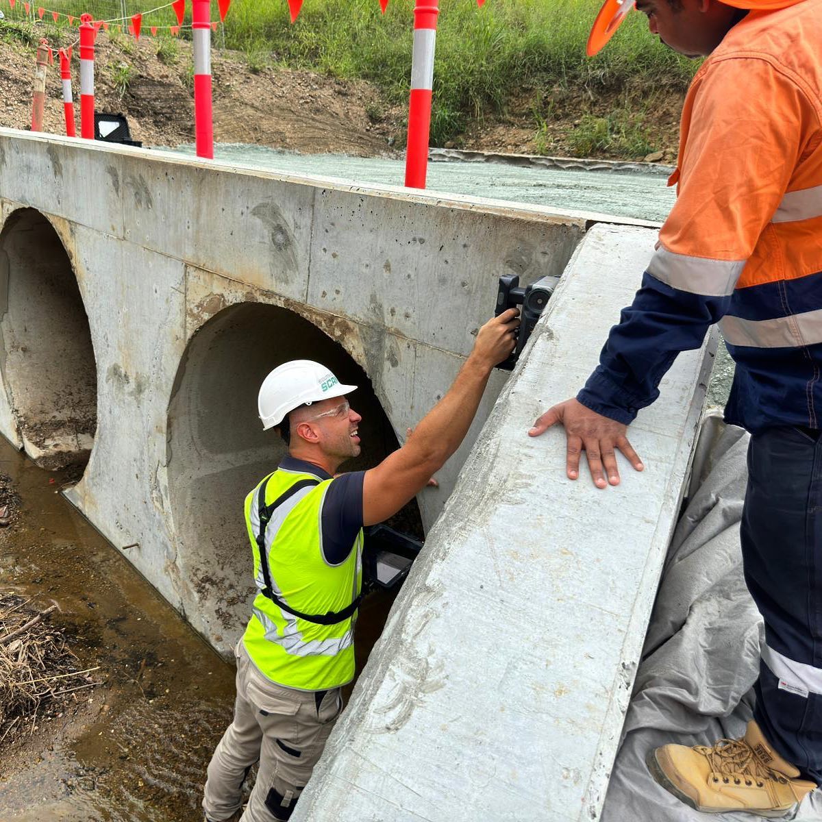 South East Scanning technician reviewing GPR scan results on a concrete surface