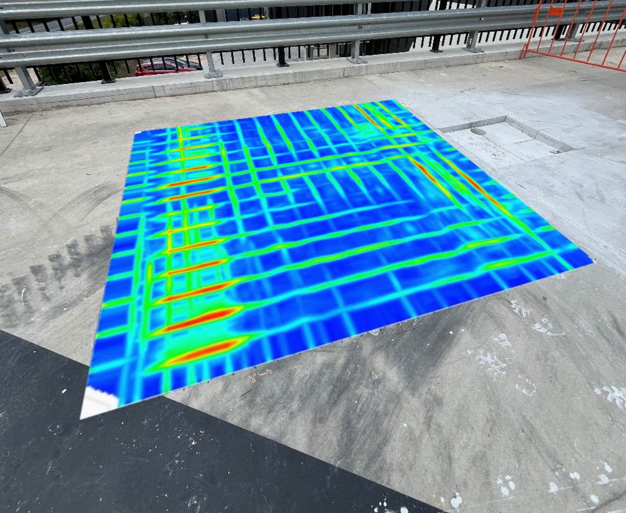 GPR depth slice of a reinforcement grid overlaid on a photograph of an external concrete slab