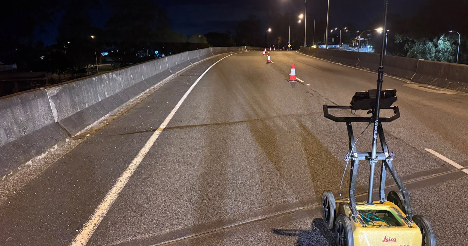 Leica DS4000 dual-frequency GPR cart with GNSS antenna on a closed flyover carriageway at night